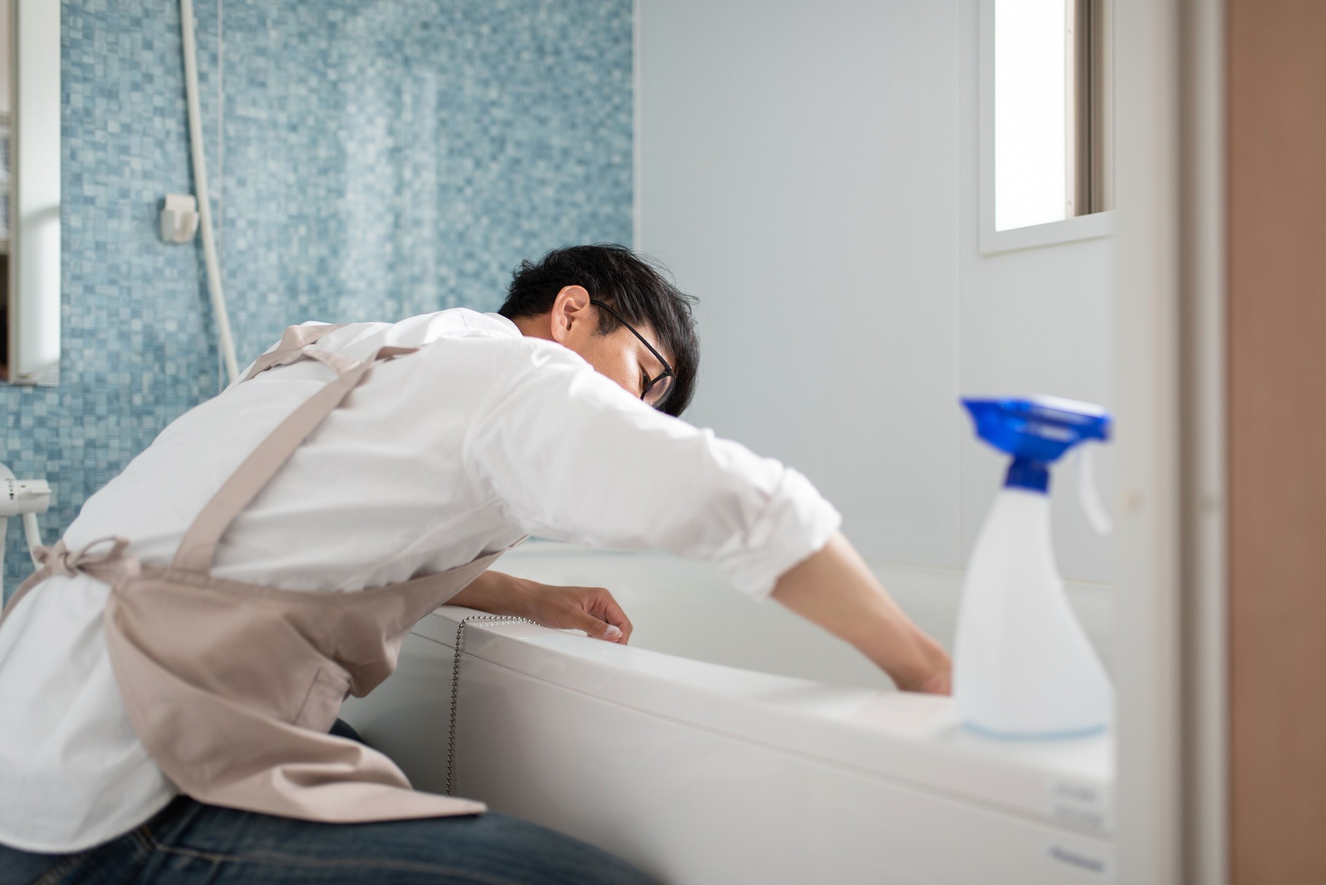 Stay-at-home-father cleaning in bath room